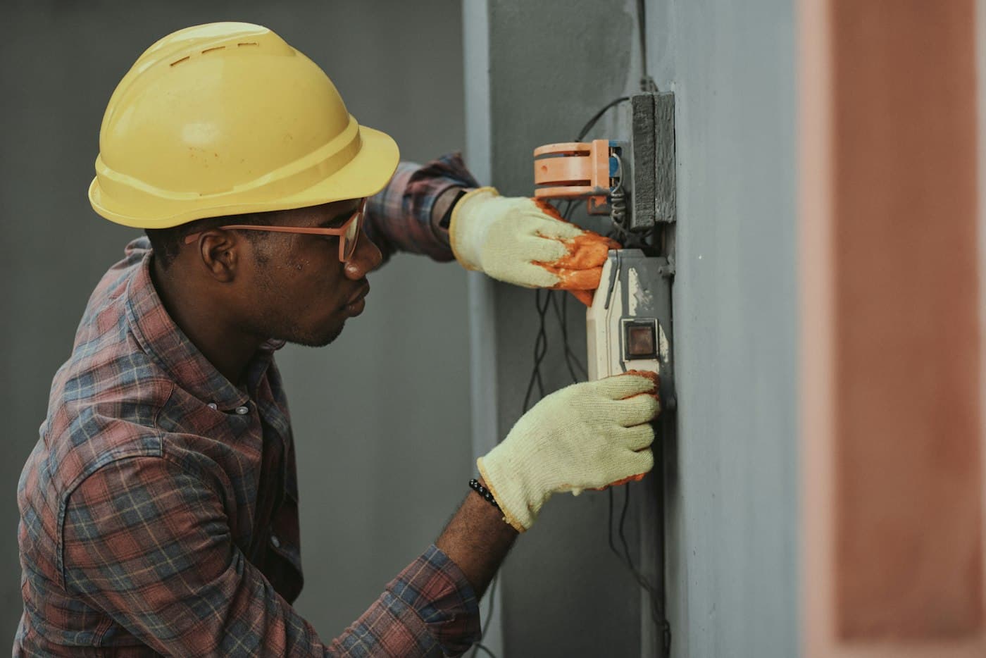 A technician working on a home electrical panel.