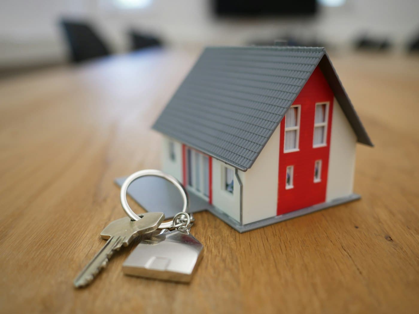 House keys beside a model home.