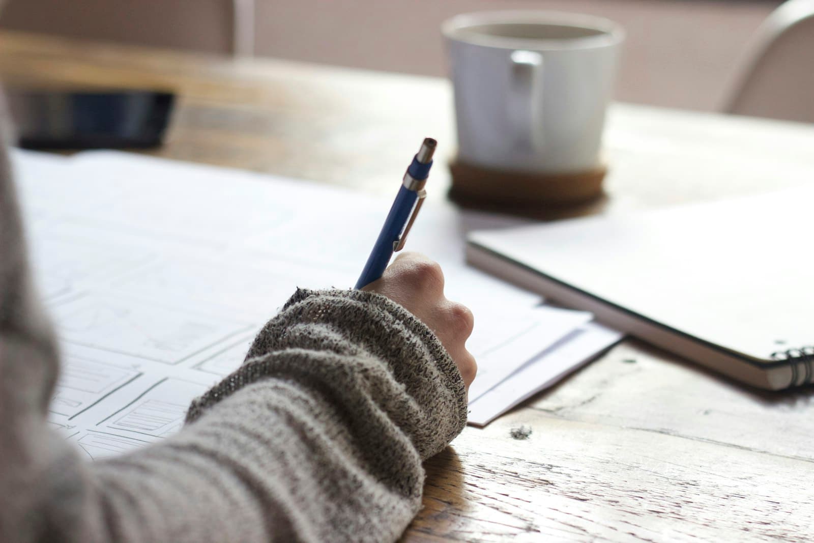 Notes being written down at a desk.